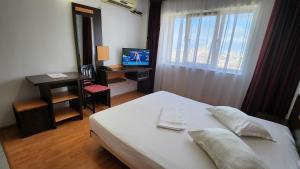 Postel nebo postele na pokoji v ubytování Arion Hotel