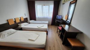 Postel nebo postele na pokoji v ubytování Arion Hotel