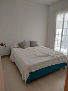 Katil atau katil-katil dalam bilik di Casa Agradable con estacionamiento privado