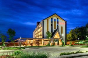 a rendering of the hotel at night at Movenpick Resort and Spa Fruske Terme in Vrdnik