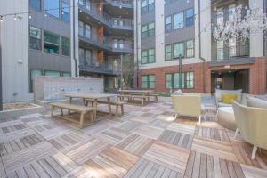 a patio with tables and chairs and buildings at Classic Unit At Downtown Austin Texas in Austin