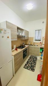 Kuchyň nebo kuchyňský kout v ubytování Residence Corte degli Aranci