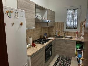 Kuchyň nebo kuchyňský kout v ubytování Residence Corte degli Aranci