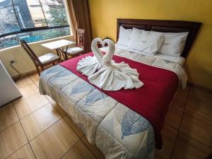 Postel nebo postele na pokoji v ubytování Hotel El Farolito
