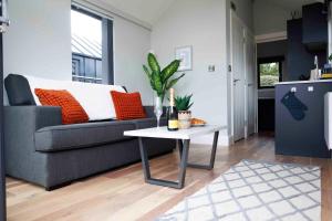 a living room with a couch and a table at Floating Home at Burton Waters in Lincoln