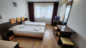 Postel nebo postele na pokoji v ubytování Arion Hotel