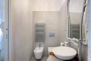 a small bathroom with a toilet and a sink at Amazing view in Tellaro +36 photos
