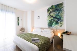 Voodi või voodid majutusasutuse Art Hotel Principe toas