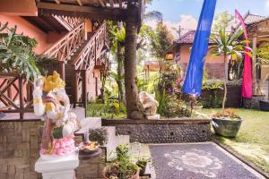 a house with a bunch of statues in front of it at Hidden paradise in Angsri