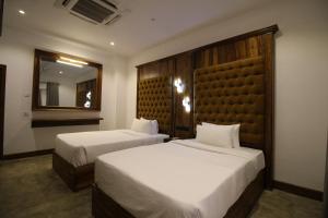 A bed or beds in a room at Hotel Refresh Blue