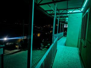 a balcony with a view of the city at night at Villa Costanza in Ripa Teatina +13 photos