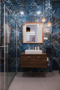 a bathroom with a sink and a mirror at Twenty2 in Zagreb