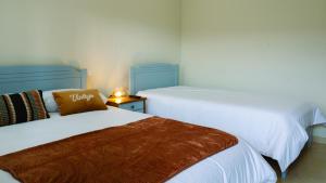 En eller flere senge i et værelse på Cova de Lobo