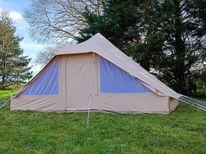 a large tent in the grass in a field at Du cote de Roussay in Roussay