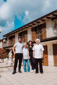 a group of people standing in front of a building at Divina Costiera in Agerola