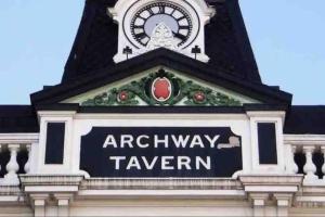 a clock tower with the words archway tavern on it at Studio 2- Archway Station in London