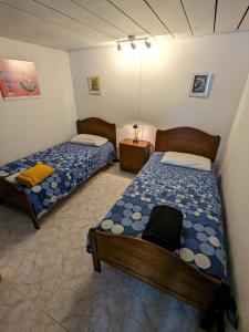 two beds in a room with two beds sidx sidx sidx at La Casa del Sol, Abades in Abades
