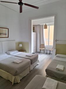 Postel nebo postele na pokoji v ubytování Casa Consell Apartments