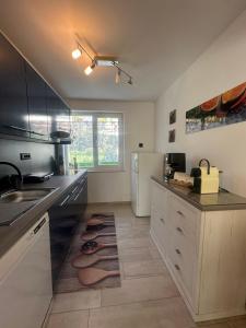 a kitchen with a sink and a refrigerator at Villa Anthony in Rovinj +57 photos