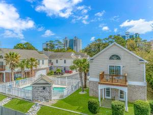 a house with a pool and a deck at Spacious 4 Bedroom House-2 Blocks From the Ocean-2185 Sanibel Court! in Myrtle Beach