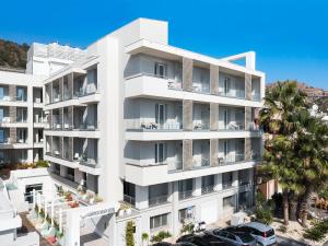 an aerial view of a white apartment building at Albatros Beach Hotel in Letojanni