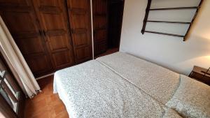 Postel nebo postele na pokoji v ubytování Torre Vella 207