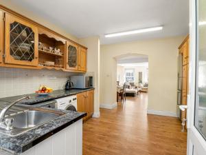 a kitchen with a sink and a counter top at King's Apartment in Clifden
