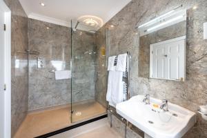 a bathroom with a sink and a shower at Imperial Hotel in Great Yarmouth