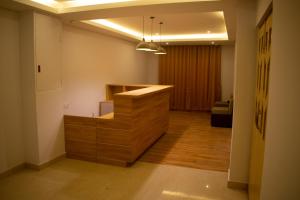 a kitchen with a wooden counter in a room at The Grand ARK in Gangtok