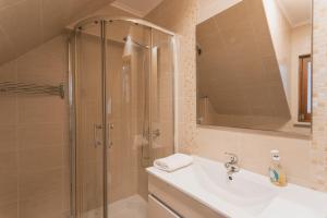 a bathroom with a shower and a sink at Best Houses 77 - Best Village I in Peniche +16 photos