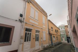 a row of buildings with doors on a street at Best Houses 77 - Best Village I in Peniche