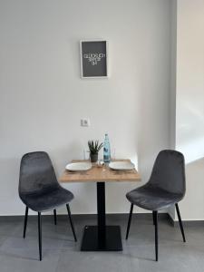 a table and two chairs in a room at Edersee Apartment Seeblick 2 in Waldeck