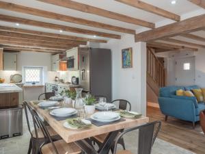 a kitchen and dining room with a table and chairs at Cilbronnau Lodge Cardigan in Llechryd