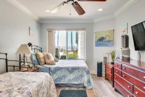 a bedroom with two beds and a flat screen tv at Bright Condo with Balcony, Steps to Oceanside Beach! in Oceanside