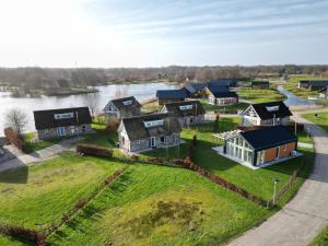 an aerial view of a village next to a river at Summio Villapark Akenveen in Tynaarlo