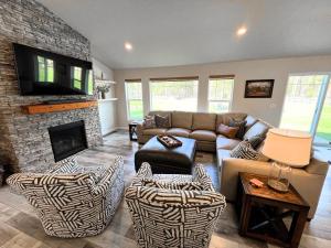 a living room with a couch and a fireplace at Timber Ridge in Columbia Falls