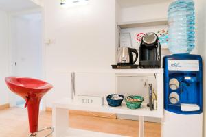 a room with a coffee maker and a bottle of water at Matlis in Alghero