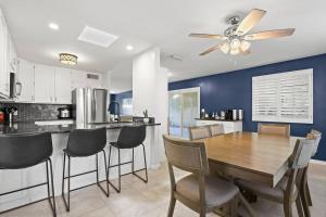a kitchen with a dining room table and chairs at Private Desert Oasis • Home Away From Home in Glendale