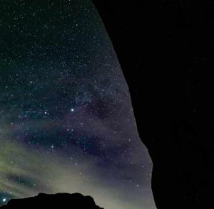 a starry night with the milky way in the sky at Wadi Rum Nabatean Camp in Wadi Rum