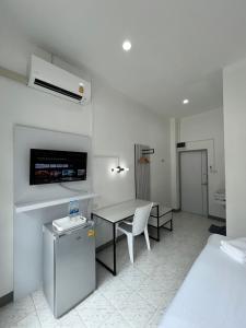TV a/nebo společenská místnost v ubytování Muangchan Hotel