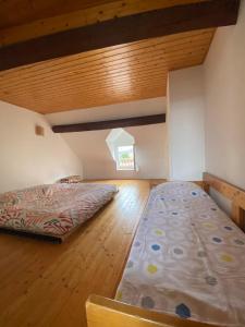 a large bedroom with a bed and a window at ED22 L'Eudoise grande maison de ville in Eu