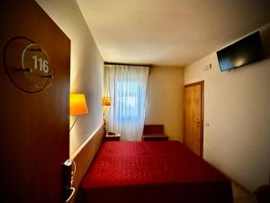 Postel nebo postele na pokoji v ubytování Hotel Ponte Molo