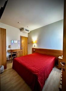 Postel nebo postele na pokoji v ubytování Hotel Ponte Molo