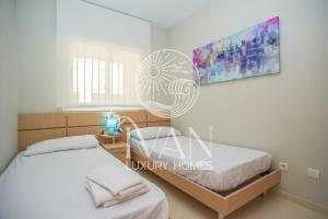 Posteľ alebo postele v izbe v ubytovaní Casa Rafael Ivan Luxury Homes 11ªPlta Sur 1ªLínea + 13 fotografií