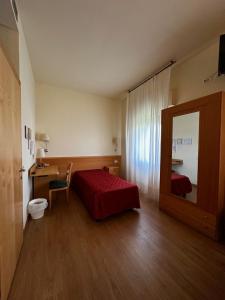 Postel nebo postele na pokoji v ubytování Hotel Ponte Molo