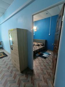 Postel nebo postele na pokoji v ubytování SR Kampar Homestay, Bandar Baru Kampar