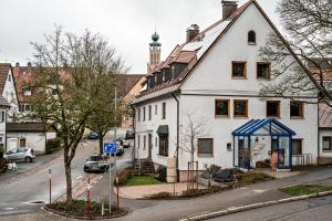 a white house on the side of a street at Fewo Straub in Freudenstadt