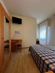 Postel nebo postele na pokoji v ubytování Hotel Ponte Molo