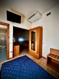 Postel nebo postele na pokoji v ubytování Hotel Ponte Molo