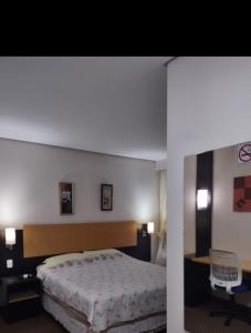 Tempat tidur dalam kamar di Century Park 607 - Apartamento na melhor região da Cidade Baixa